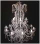 Elegant Tiered 12 Light Chandelier With Crystal Drop Features.