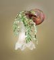 Edera Design 1 Light wall lamp That has hand forged leaves details