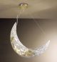Forme design metal moon shape chandelier that has drill & flame cut details
