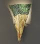 Forme design metal triangular wall light that has drill & flame cut details