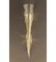 Forme design metal cone wall light that has drill & flame cut details